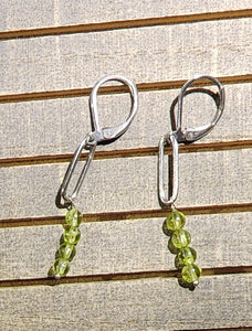 Twin Girl Spirits Attached to Peridot Dangle Earrings SS Lever-Back by Meta Moondance